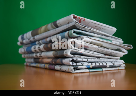 Stack of reading and research newspaper an old fashioned way of consuming news of the day Stock Photo