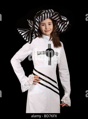 Young girl in black and white dress with black and white 'My Fair Lady' style hat Stock Photo