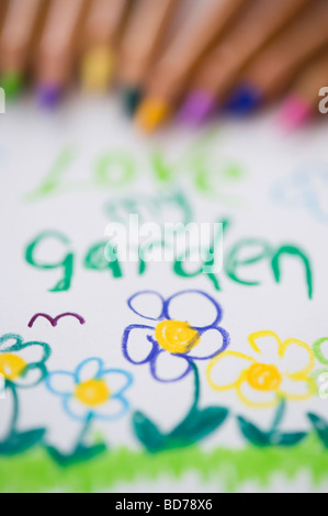 Love my garden, child's drawing and coloured pencils Stock Photo