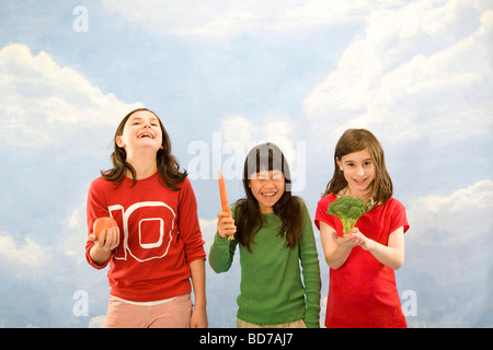 Children holding different foods Stock Photo