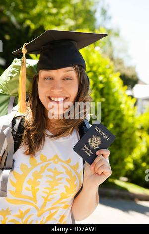 Young woman with backpack and passport Stock Photo