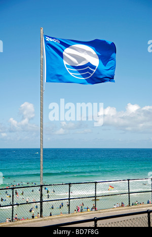 the blue flag for beach and water cleanliness flying over porthmeor beach in st.ives,cornwall,uk Stock Photo