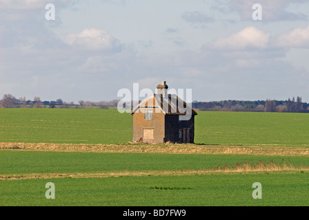 Boarded-up farm house, believed to have be abandoned after the 1953 floods, Felixstowe Ferry, Suffolk, UK. Stock Photo