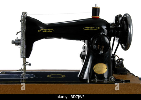 Vintage sewing machine isolated over a white background Stock Photo - Alamy