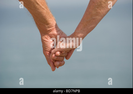 mature couple holding hands Stock Photo