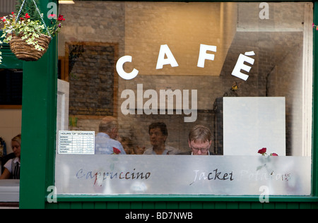 Man in window of cafe Stock Photo