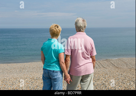 mature couple looking out to sea Stock Photo