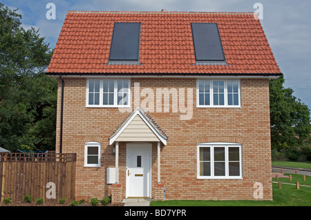 Newly built low carbon house with built-in rooftop solar panels. Stock Photo