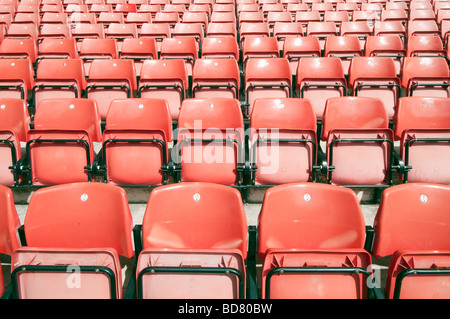 Rows of red 'flip up' seats inside a 'football stadium' Stock Photo