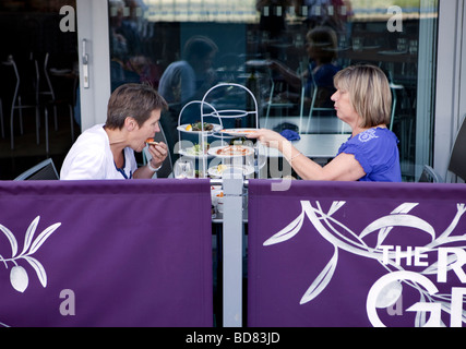 Two women having afternoon tea. Stock Photo