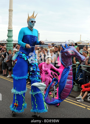 people in fancy dress taking part in this years Brighton Pride procession many in fancy dress or outrageous outfits Stock Photo