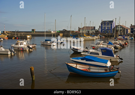 Aberaeron Harbour on the south side looking north with the harbourmaster hotel in the distance Stock Photo