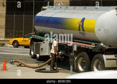 An independent gasoline station in the New York borough of Queens gets a delivery Stock Photo