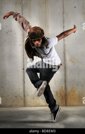 African American hip hop man dancing over a grungy background Stock Photo