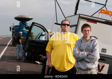 Storm chasers left to right Chris Bowman and Matthew Rydzik converse as they watch a storm in southern Kansas Stock Photo