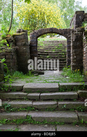 Steps leading to arch in in Rivington terraced gardens Lancashire UK Stock Photo