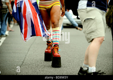 gay man wearing huge platform boots taking part in this years Brighton Pride Stock Photo