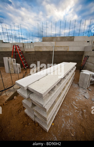 Recycled styrofoam and light wight concrete make up these building materials as block walls rise and a new home takes shape Stock Photo