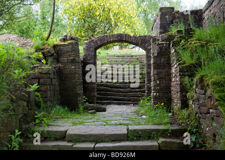 Steps leading to arch in in Rivington terraced gardens Lancashire UK Stock Photo