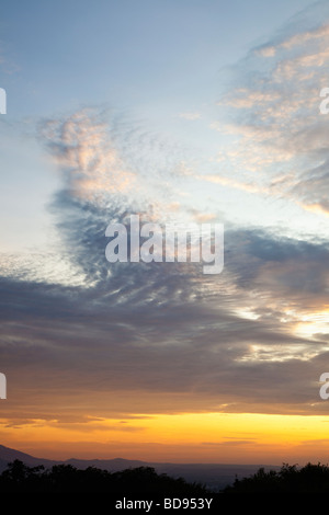 Sunset sky over horizon with stratocumulus clouds Stock Photo