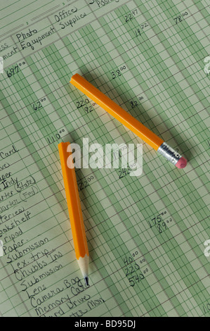 Accounting Ledger and Broken Pencil Stock Photo