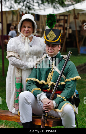 Couple in Early Nineteenth Century Costume Sitting at Encampment at Reenactment in Corydon Indiana Stock Photo