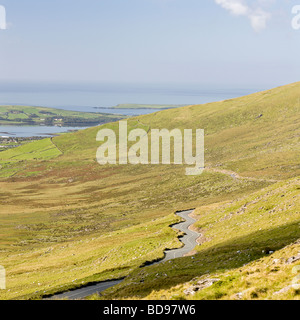 Connor Pass Road to Dingle Town and the sea.. The winding road of the Connor Pass from sea to peak Stock Photo