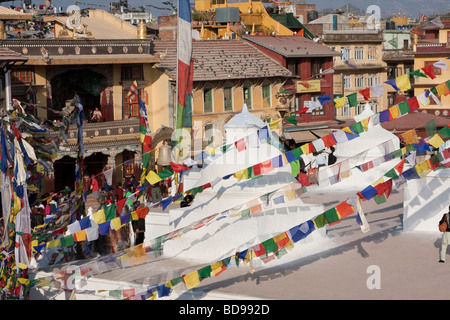 Bodhnath, Nepal.  View of Buildings Surrounding the Stupa. Tamang Gompa on Left.  Prayer Flags. Stock Photo