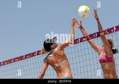 Two women athletes competing in the Hermosa Beach, Ca  AVP volleyball series Stock Photo