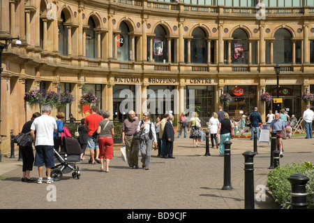 Shoppers people visitors at Harrogate Victoria Shopping Centre shops stores in summer North Yorkshire England UK United Kingdom GB Great Britain Stock Photo