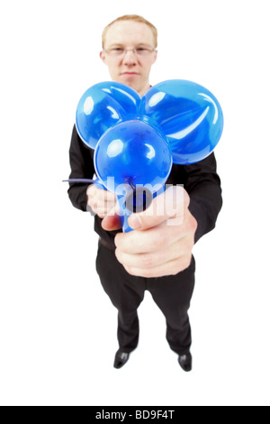 young magic tinkering a balloon animal with balloons Stock Photo