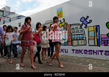 A group of teenagers walking in Harajuku street area renowned for its unique street fashion Shybuya district Tokyo Japan Stock Photo