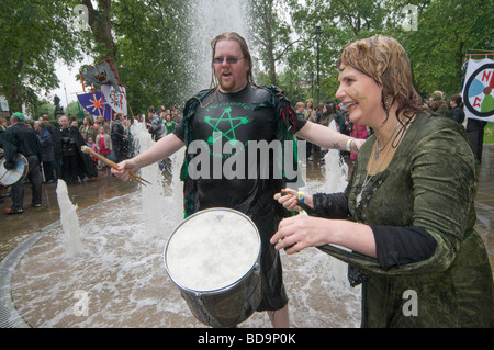 The Pagan Pride Parade in the Beltane Bash celebrations and dance around the fountain in Russell Square and drummers get wet Stock Photo