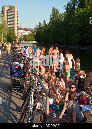 Letten at river Limmat people sunbathing Zurich Switzerland Stock Photo