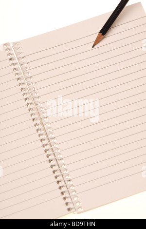 Pencil on a open notebook with spiral Stock Photo
