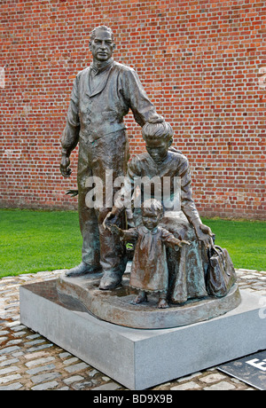 The ' Emigrants ' statue at the Albert Dock in Liverpool, UK, rates Stock Photo