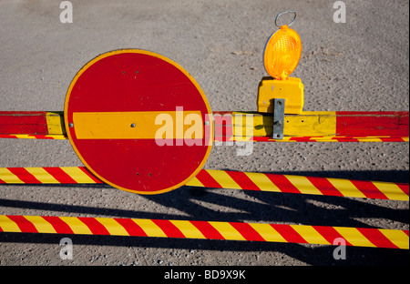 Warning light at roadworks site plus Finnish traffic sign ( No entry )