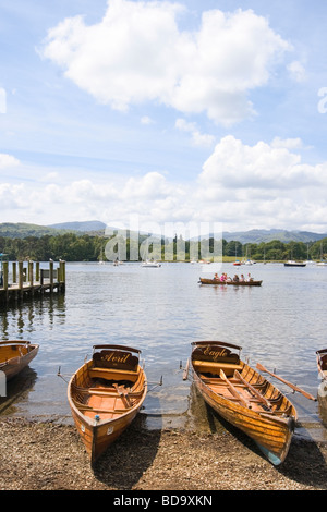 Rowing boats for hire on the shore of Lake Windermere Cumbria England Stock Photo