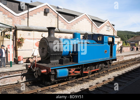 Blue steam locomotive engine in the Lakeside railway station on the Lakeside Haverthwaite railway line Cumbria England Stock Photo