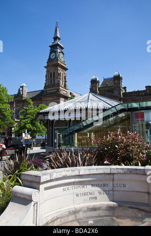 Southport Rotary Club Wishing Well and Tourist Information Centre in front Southport Arts Centre UK Stock Photo