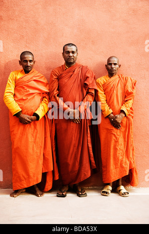 Portrait of three monks, Bodhgaya, Gaya, Bihar, India Stock Photo