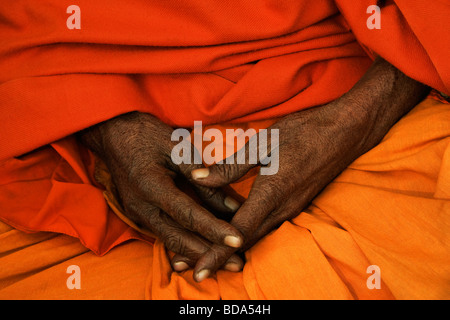 Mid section view of a sadhu praying, Varanasi, Uttar Pradesh, India Stock Photo