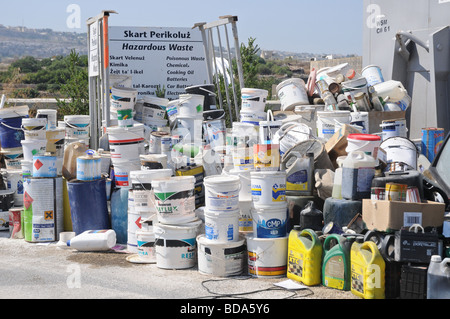 Paint buckets and fuel containers ready to be recycled at a waste management plant in Malta. Hazardous waste directive Stock Photo