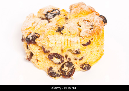 A close up of a homemade fruit scone on a white background Stock Photo