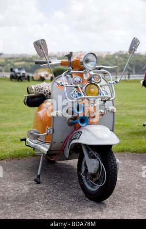 Original orange and Grey Lambretta 1960's motor cycle in show with Chromes, Klaxon, mirrors headlights. 96823 Vintage Car Stock Photo