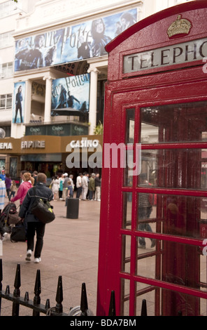 The Empire Cinema and Casino in Leicester Square with Harry Potter film poster advertisments shot past red telephone box Stock Photo