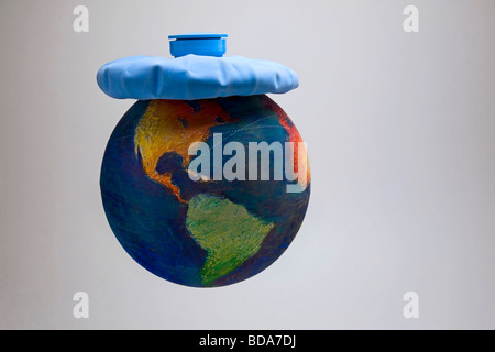 Still shot of a world globe with an ice pack on it Stock Photo