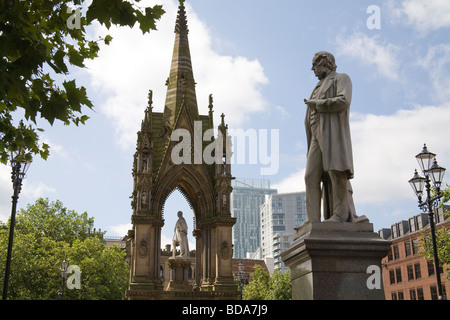 Manchester England UK Statue of John Bright and the Albert memorial in Albert Square British Radical who abolished Corn Laws promotor free trade laws Stock Photo