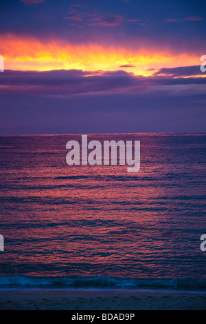 Sunset and clouds over Atlantic Ocean on Porthmeor Beach summer twilight St Ives West Penwith Cornwall England UK United Kingdom Stock Photo