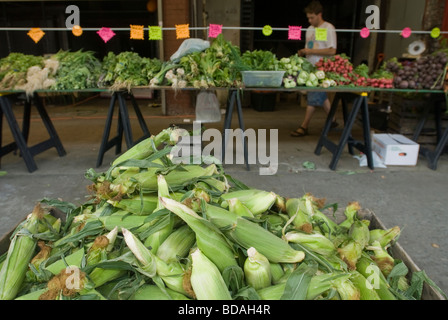 Corn is among the fresh fruits and vegetables at the Fulton Stall Market in South Street Seaport in New York Stock Photo